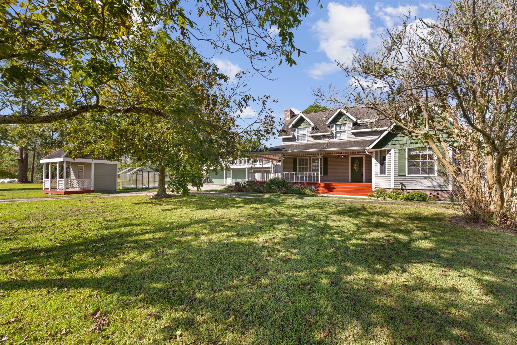 4910 Cark Street Santa Fe, TX 77517 - Photo 3 of 31 a front view of a house with a garden