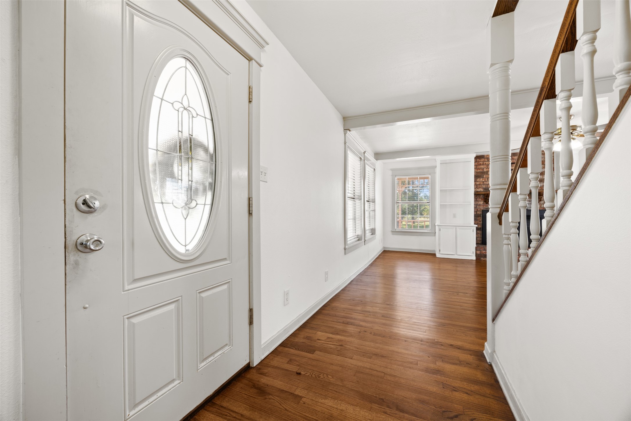 4910 Cark Street Santa Fe, TX 77517 - Photo 6 of 31 a view of a hallway with wooden floor and entryway