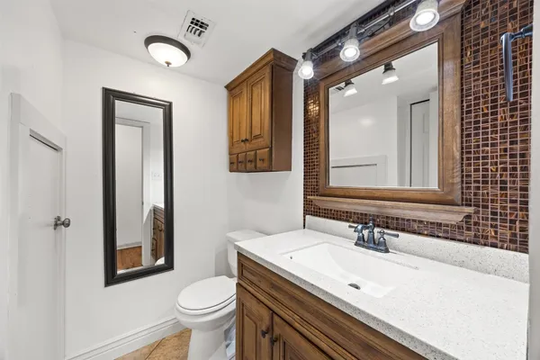 a bathroom with a sink and a toilet