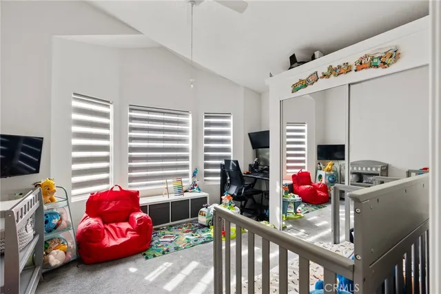 a bedroom with furniture and a window