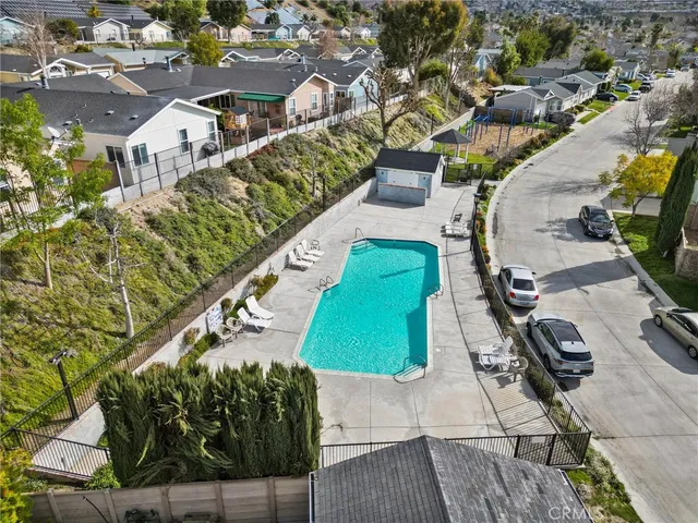 an aerial view of a house with a yard and lake view