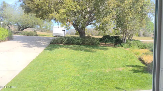 a view of backyard with green space