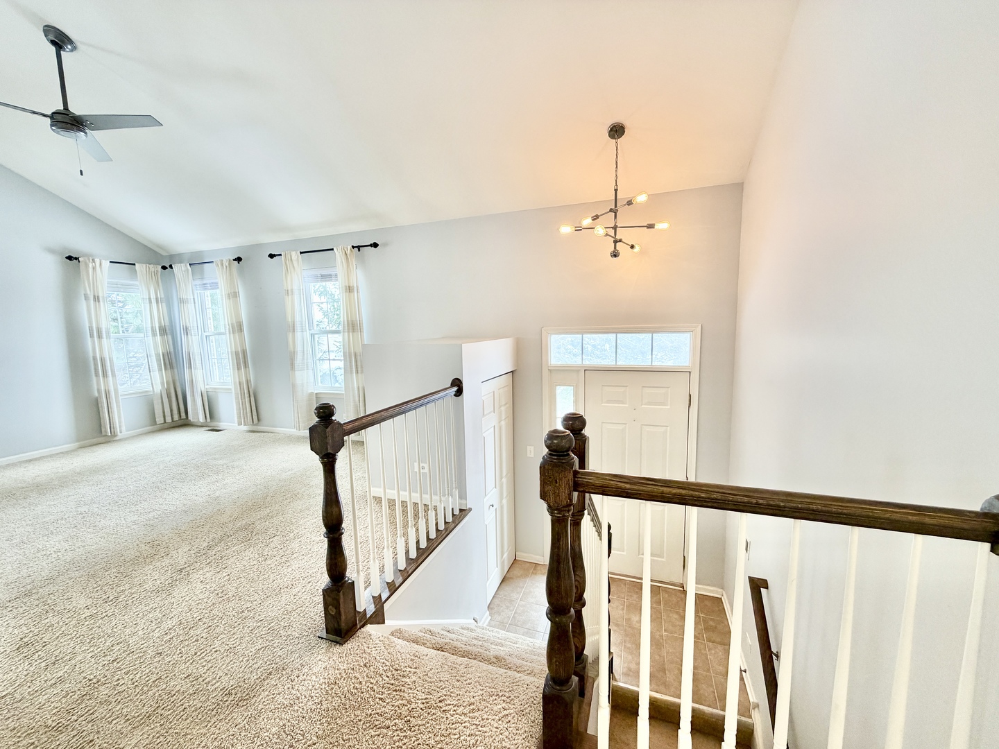 898 Emerald Drive Pingree Grove, IL 60140 - Photo 11 of 23 a view of a hallway with a window and stairs