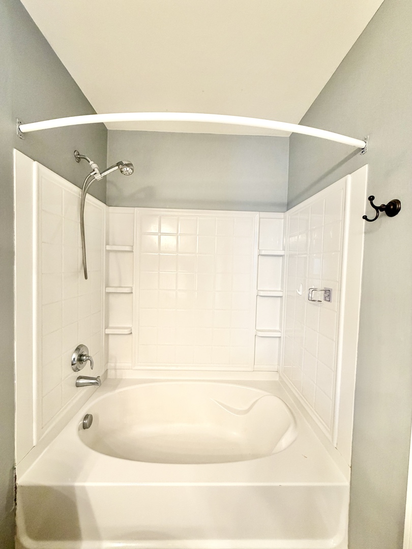 898 Emerald Drive Pingree Grove, IL 60140 - Photo 15 of 23 a bathroom with a bathtub and shower