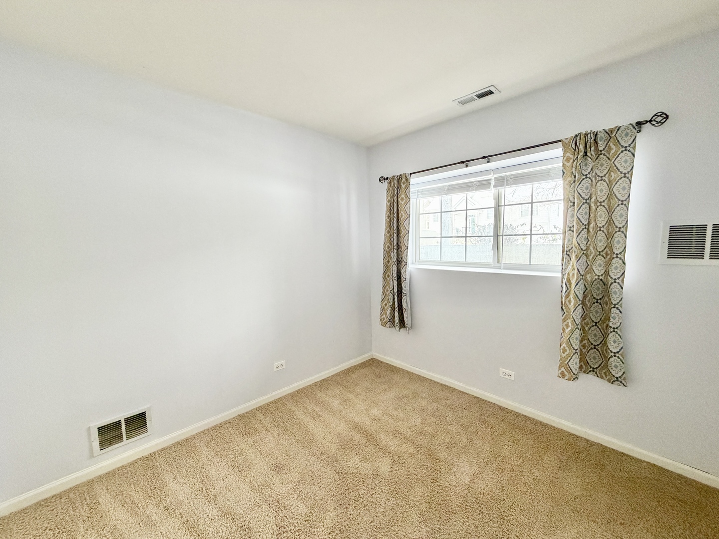 898 Emerald Drive Pingree Grove, IL 60140 - Photo 22 of 23 a view of an empty room with a window