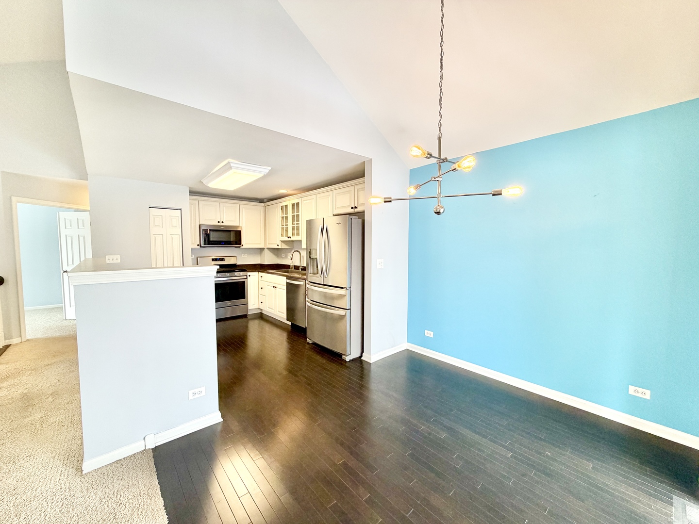 898 Emerald Drive Pingree Grove, IL 60140 - Photo 6 of 23 a kitchen with refrigerator and white cabinets