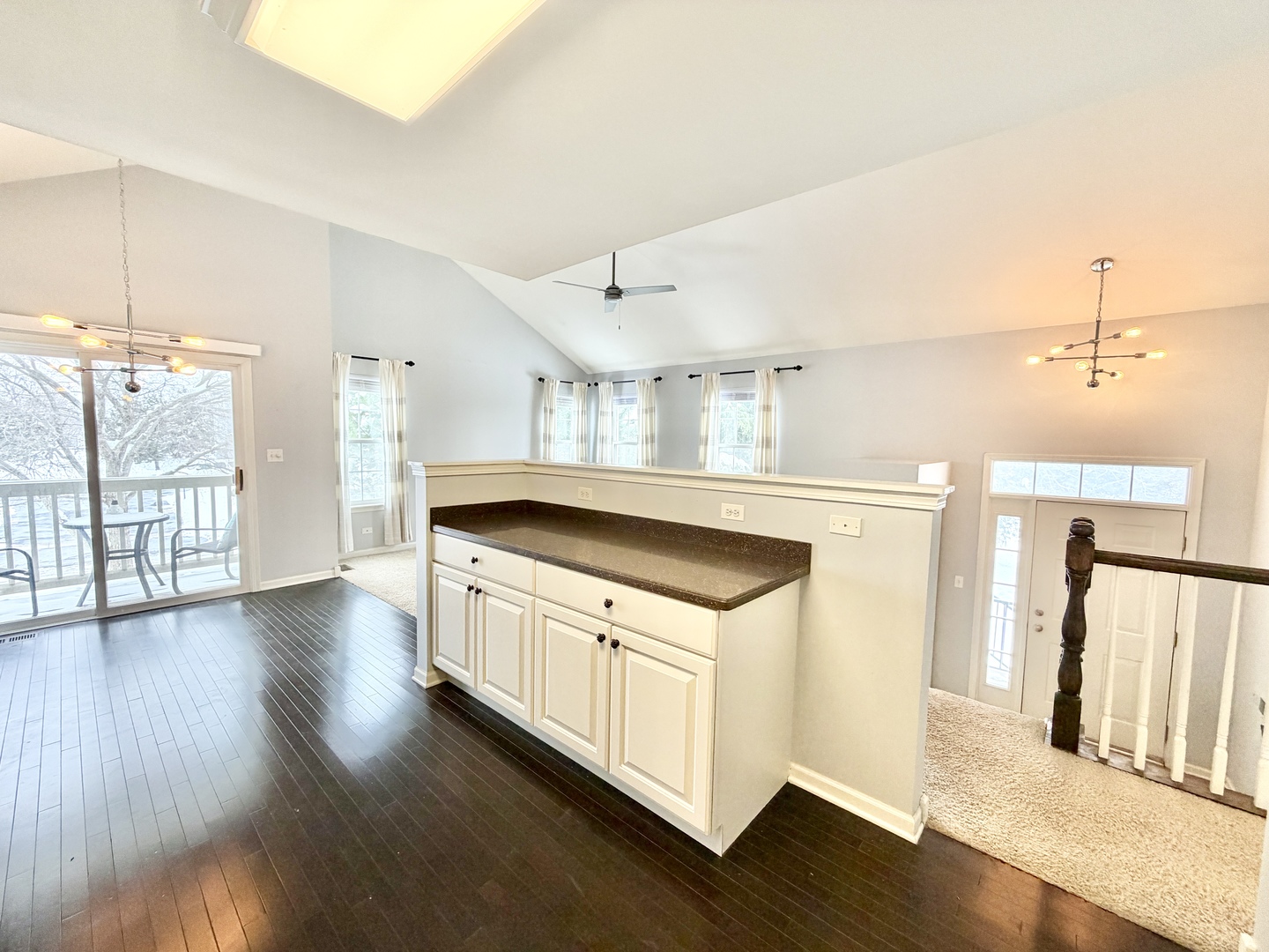 898 Emerald Drive Pingree Grove, IL 60140 - Photo 10 of 23 a kitchen with stainless steel appliances granite countertop a sink a stove a refrigerator and white cabinets with wooden floor
