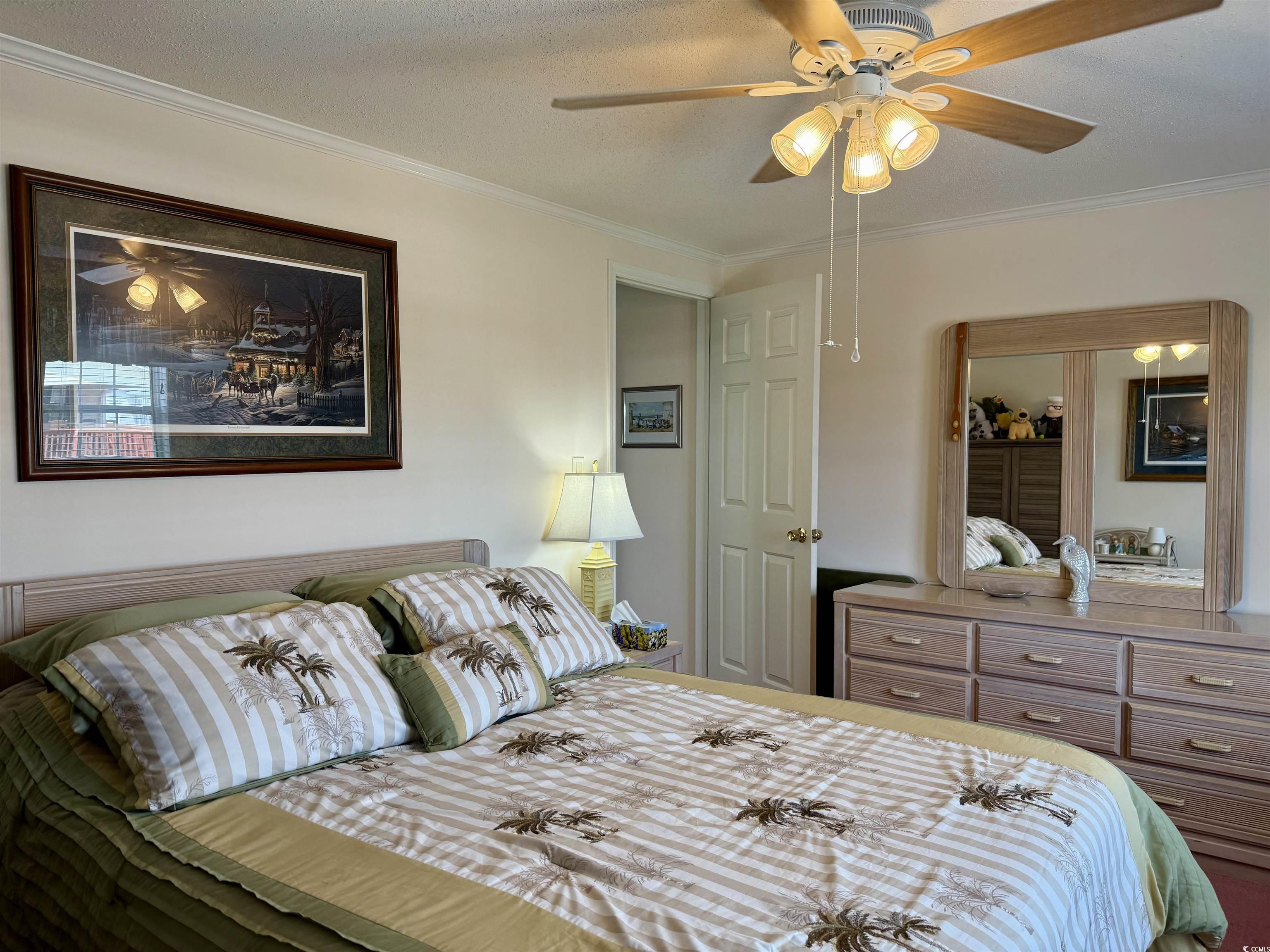1506 Mason Circle Surfside Beach, SC 29575 - Photo 16 of 33 Bedroom featuring ornamental molding and a ceiling fan