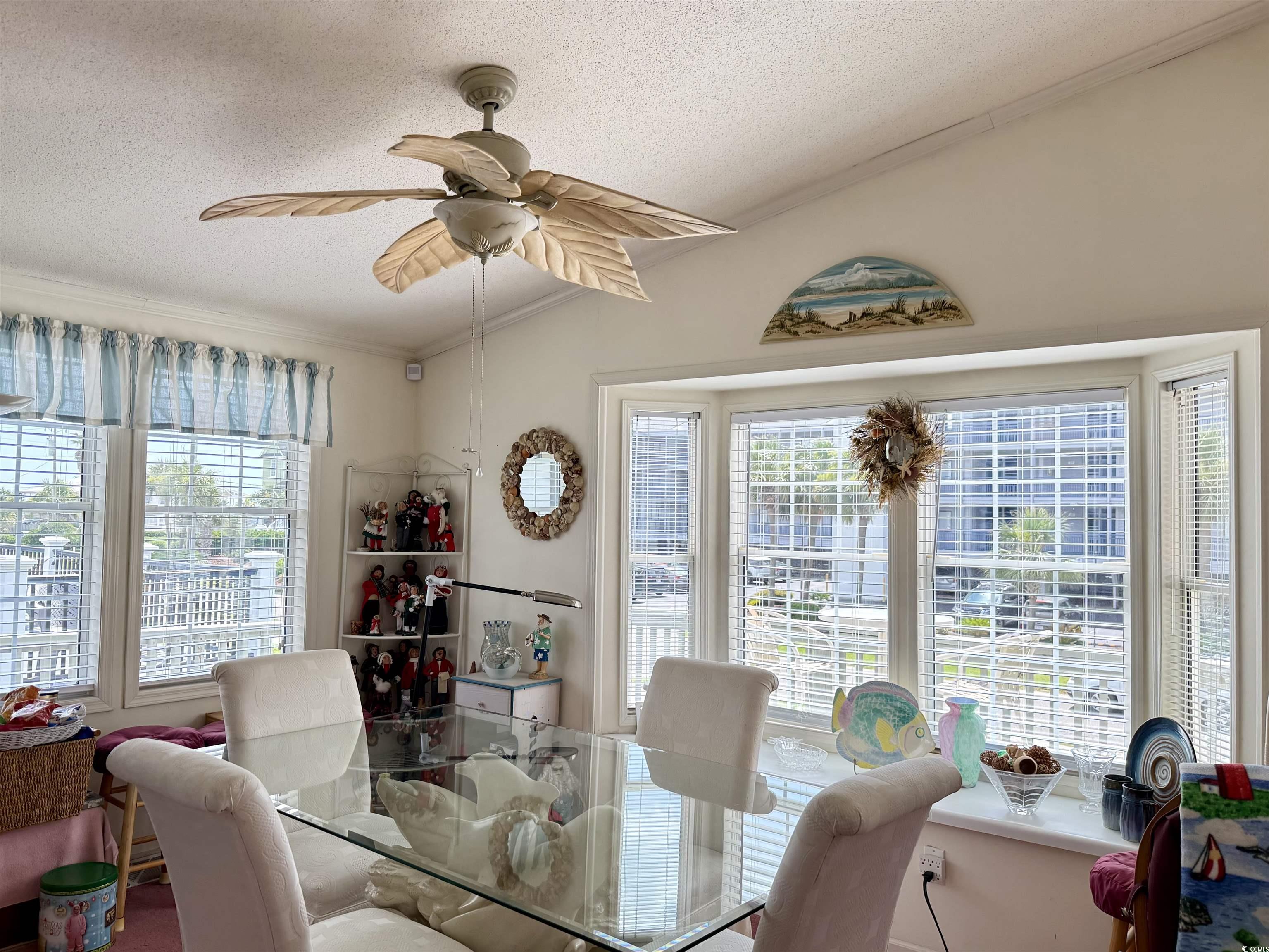 1506 Mason Circle Surfside Beach, SC 29575 - Photo 4 of 33 Dining room with crown molding, a textured ceiling, and ceiling fan