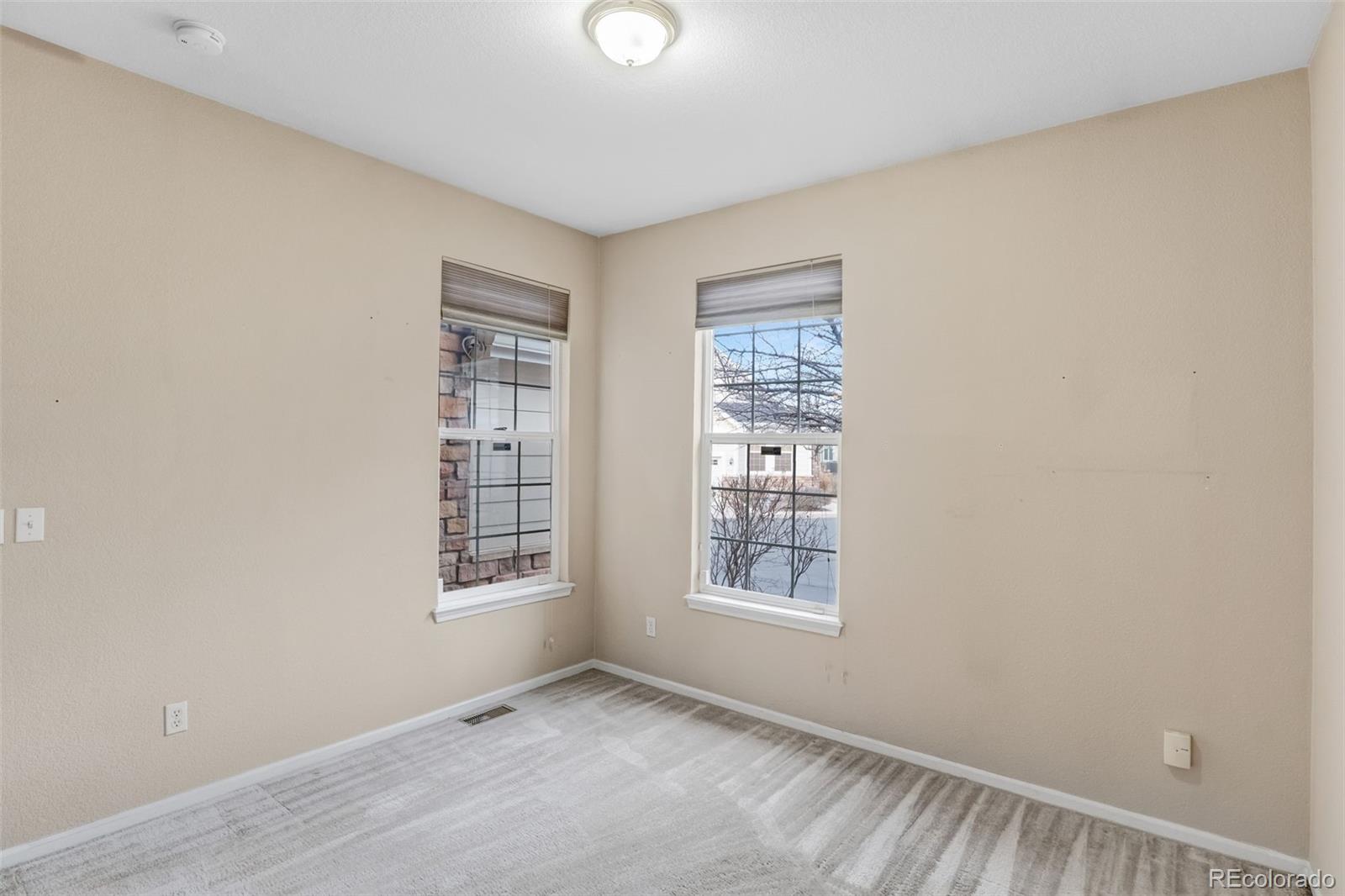 6656 South Reed Way, Unit B Littleton, CO 80123 - Photo 17 of 32 a view of an empty room with a window