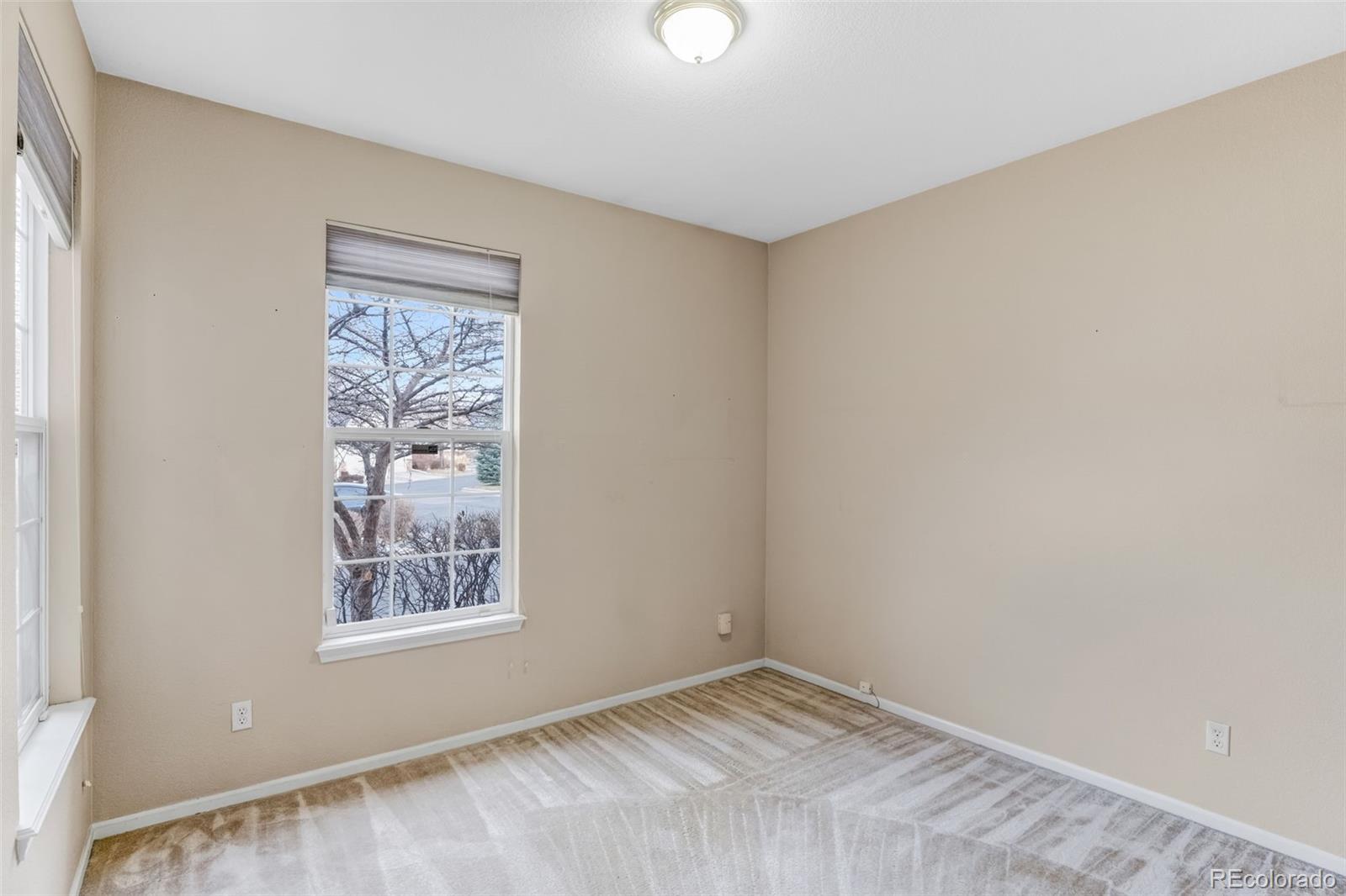 6656 South Reed Way, Unit B Littleton, CO 80123 - Photo 18 of 32 a view of an empty room with a window