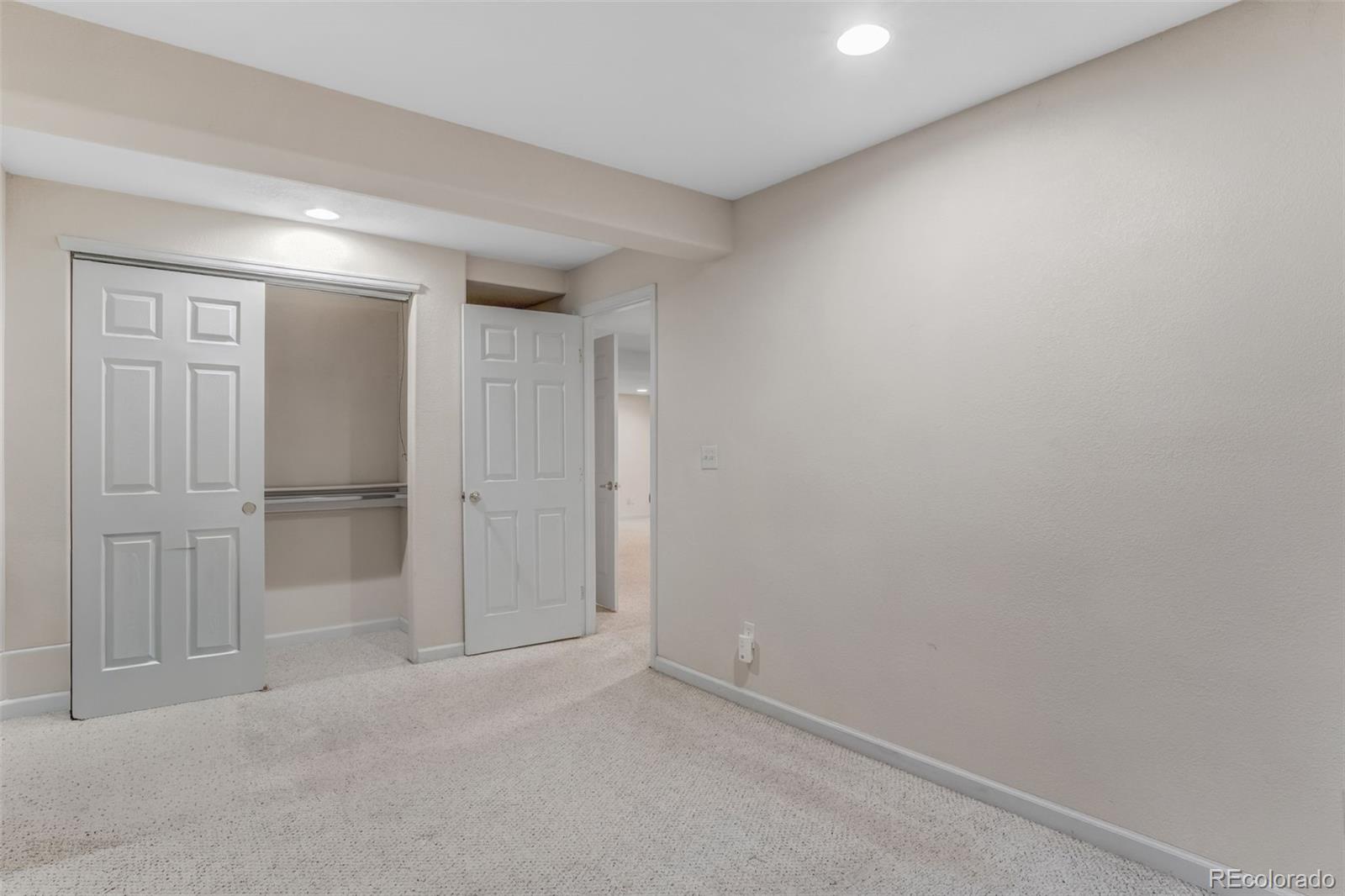 6656 South Reed Way, Unit B Littleton, CO 80123 - Photo 25 of 32 an empty room with closet area