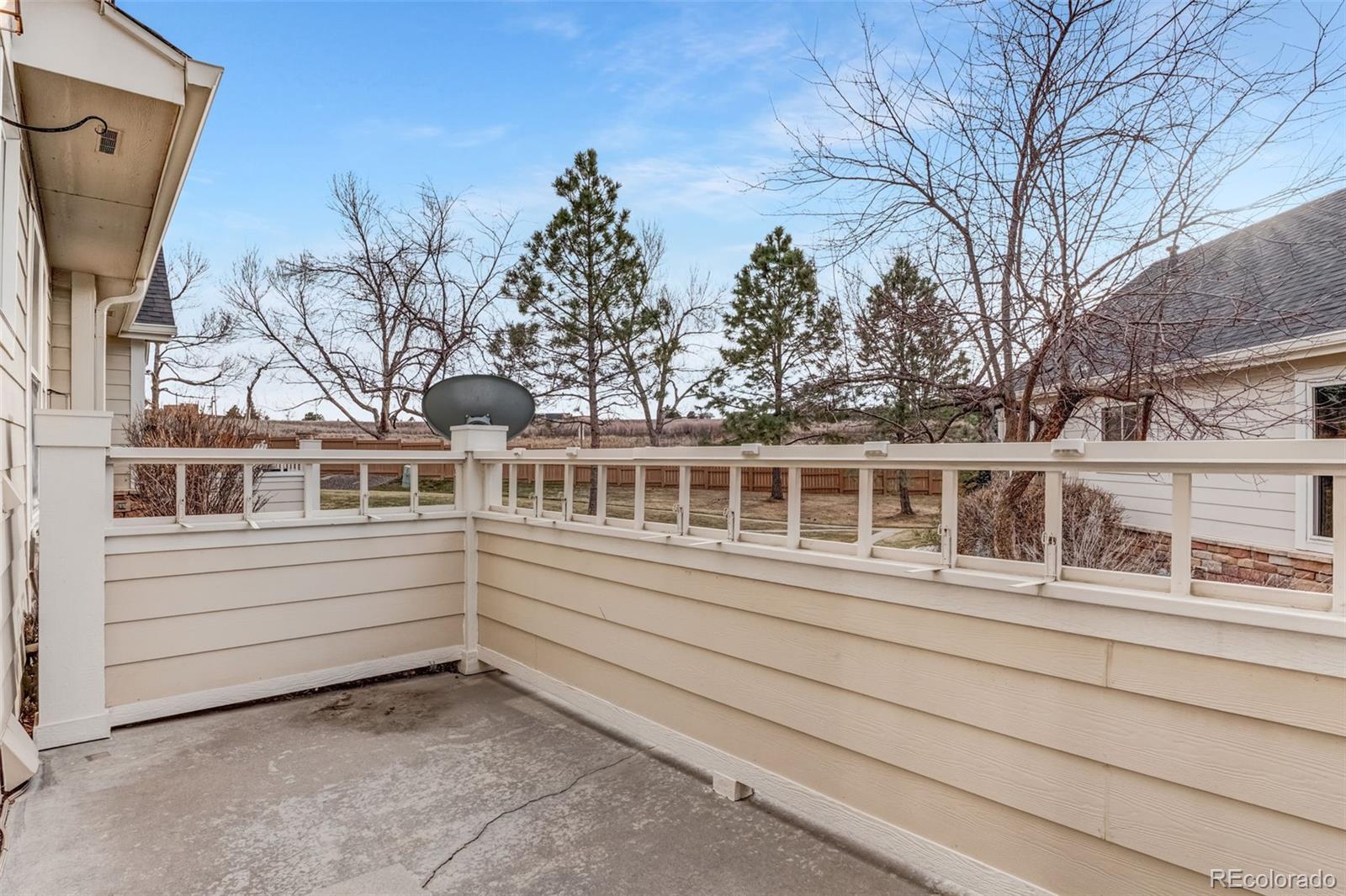 6656 South Reed Way, Unit B Littleton, CO 80123 - Photo 27 of 32 a front view of a house with a garden