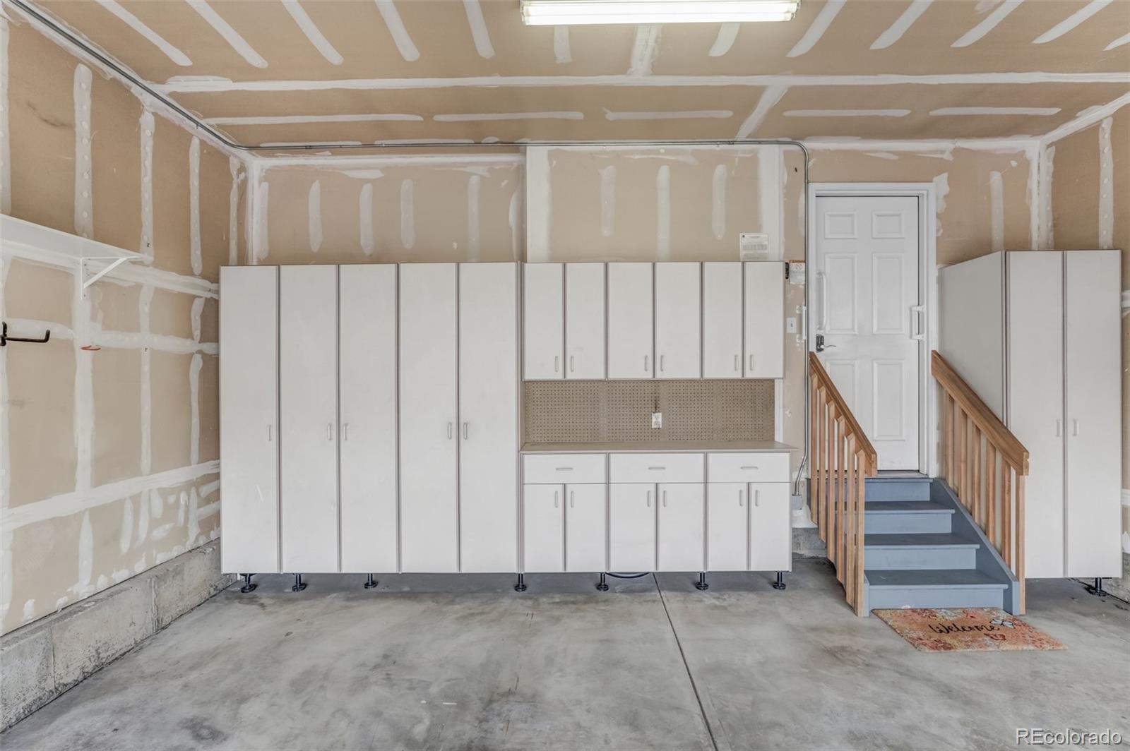 6656 South Reed Way, Unit B Littleton, CO 80123 - Photo 29 of 32 a view of an empty room with stairs
