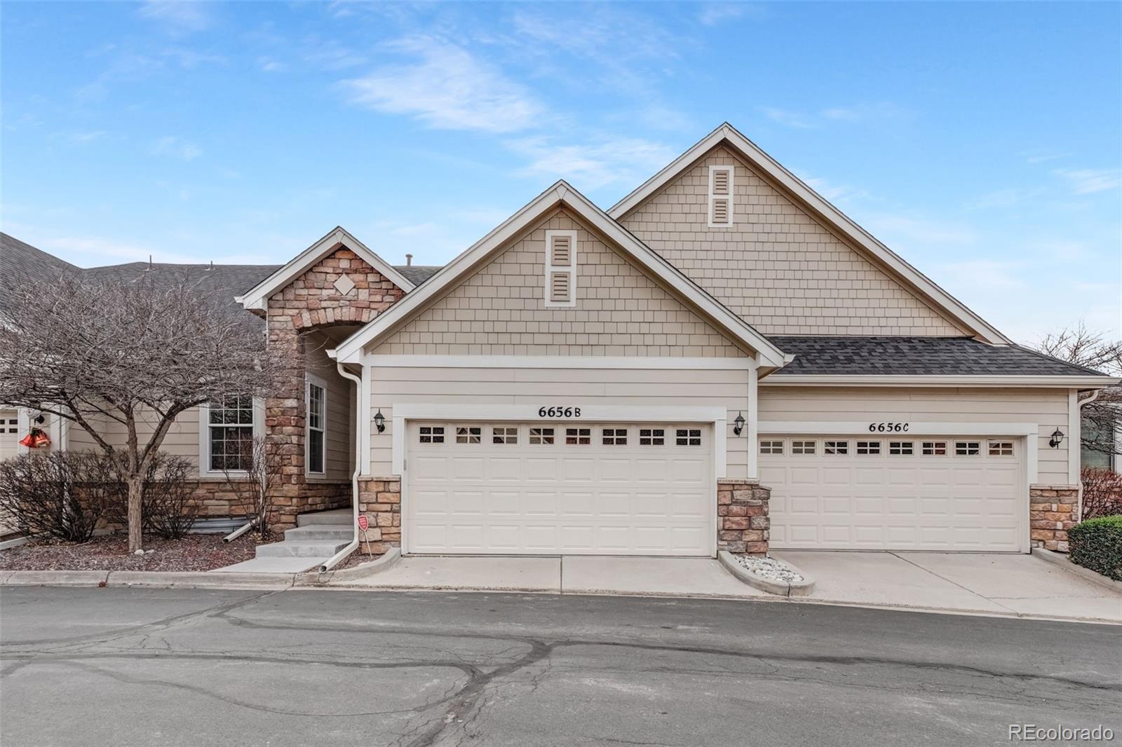 6656 South Reed Way, Unit B Littleton, CO 80123 - Photo 30 of 32 a view of a house with a small yard and large tree