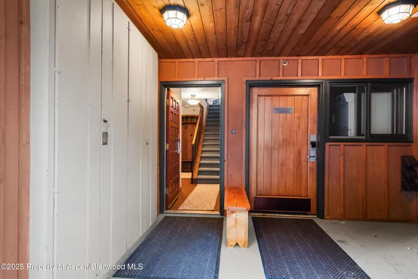 a view of front door with wooden floor