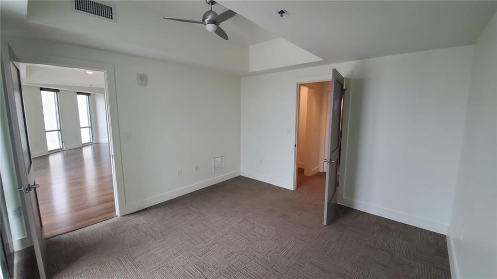 1100 Howell Mill Road Northwest, Unit 917 Atlanta, GA 30318 - Photo 14 of 22 a view of an empty room with a window