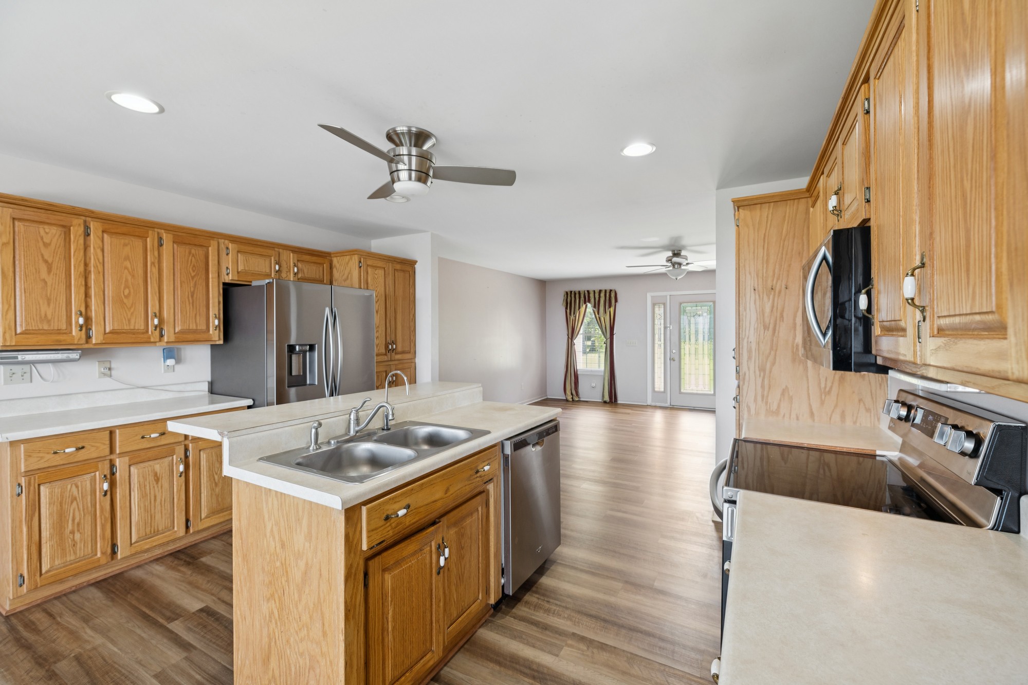 7365 Rowe Gap Road Belvidere, TN 37306 - Photo 17 of 78 a kitchen with stainless steel appliances granite countertop a sink stove and refrigerator