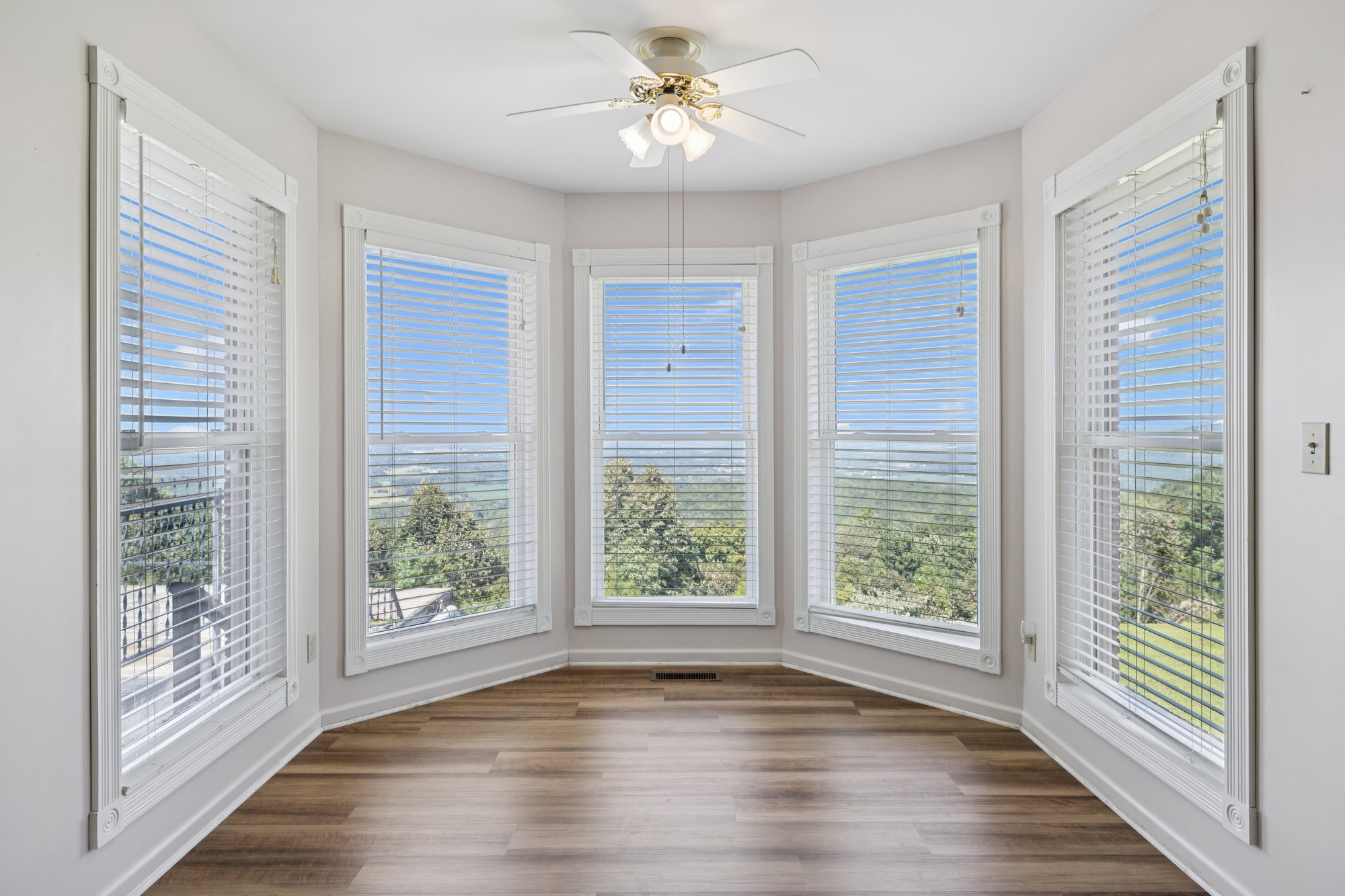 7365 Rowe Gap Road Belvidere, TN 37306 - Photo 19 of 78 a view of an empty room with wooden floor and a window