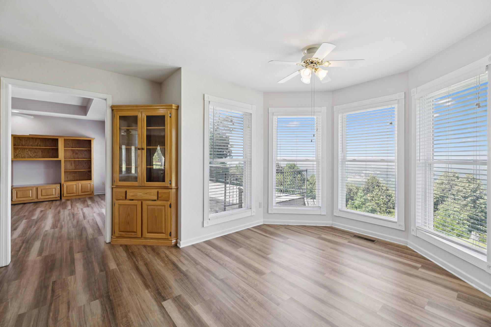 7365 Rowe Gap Road Belvidere, TN 37306 - Photo 20 of 78 a view of an empty room with wooden floor and a window