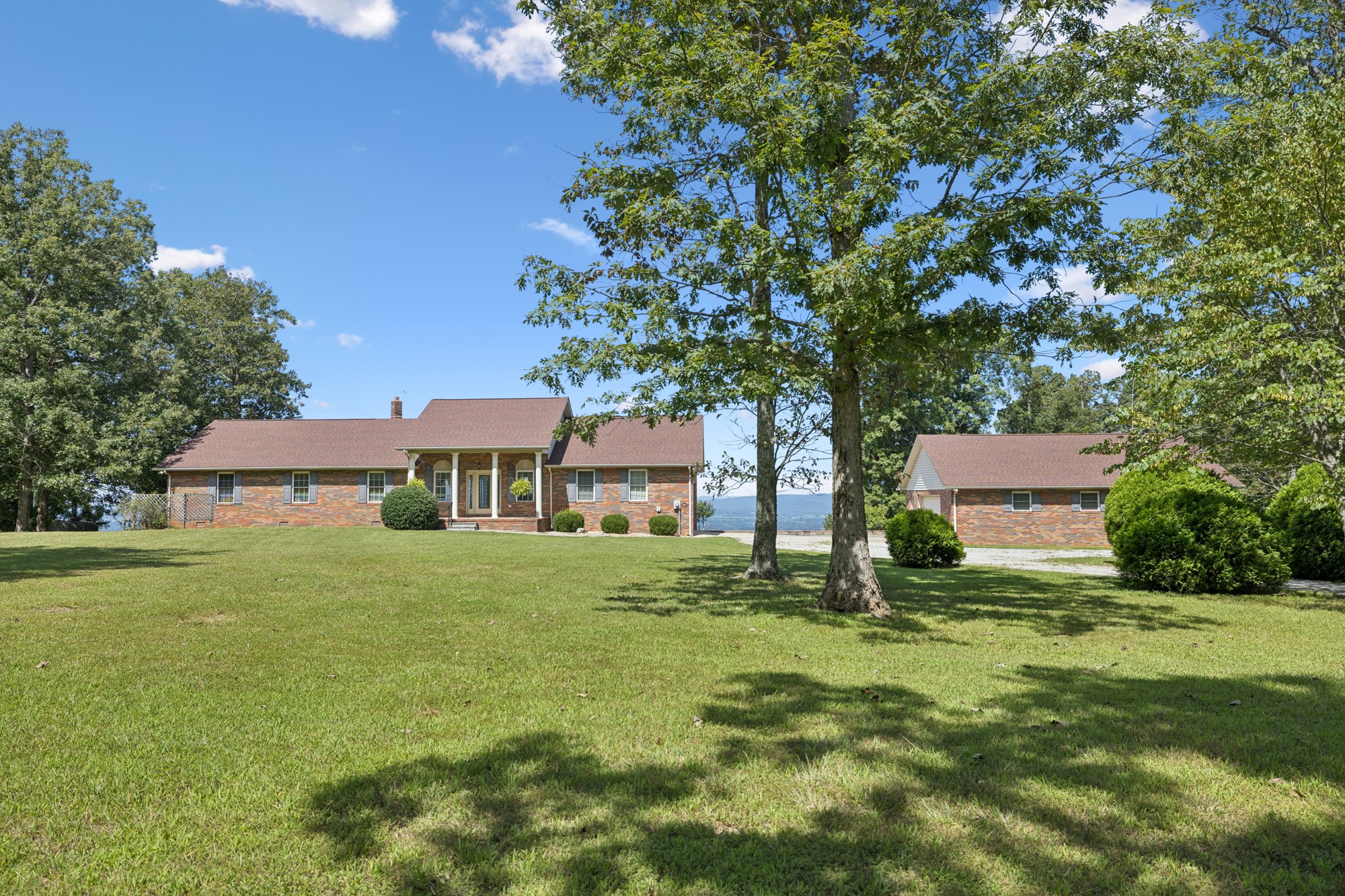 7365 Rowe Gap Road Belvidere, TN 37306 - Photo 2 of 78 a house with a tree in front of it