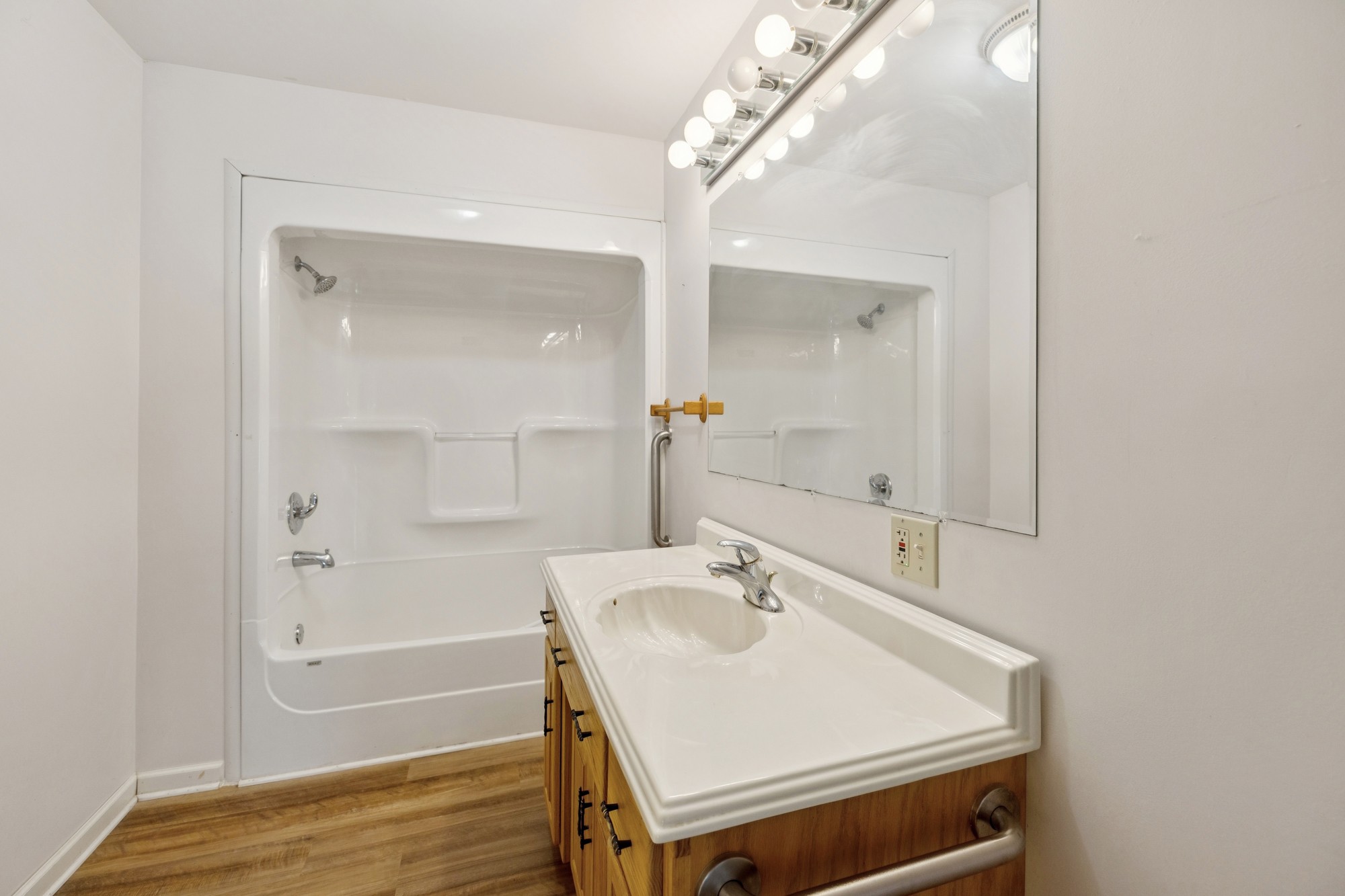 7365 Rowe Gap Road Belvidere, TN 37306 - Photo 33 of 78 a bathroom with a sink a mirror and a bathtub