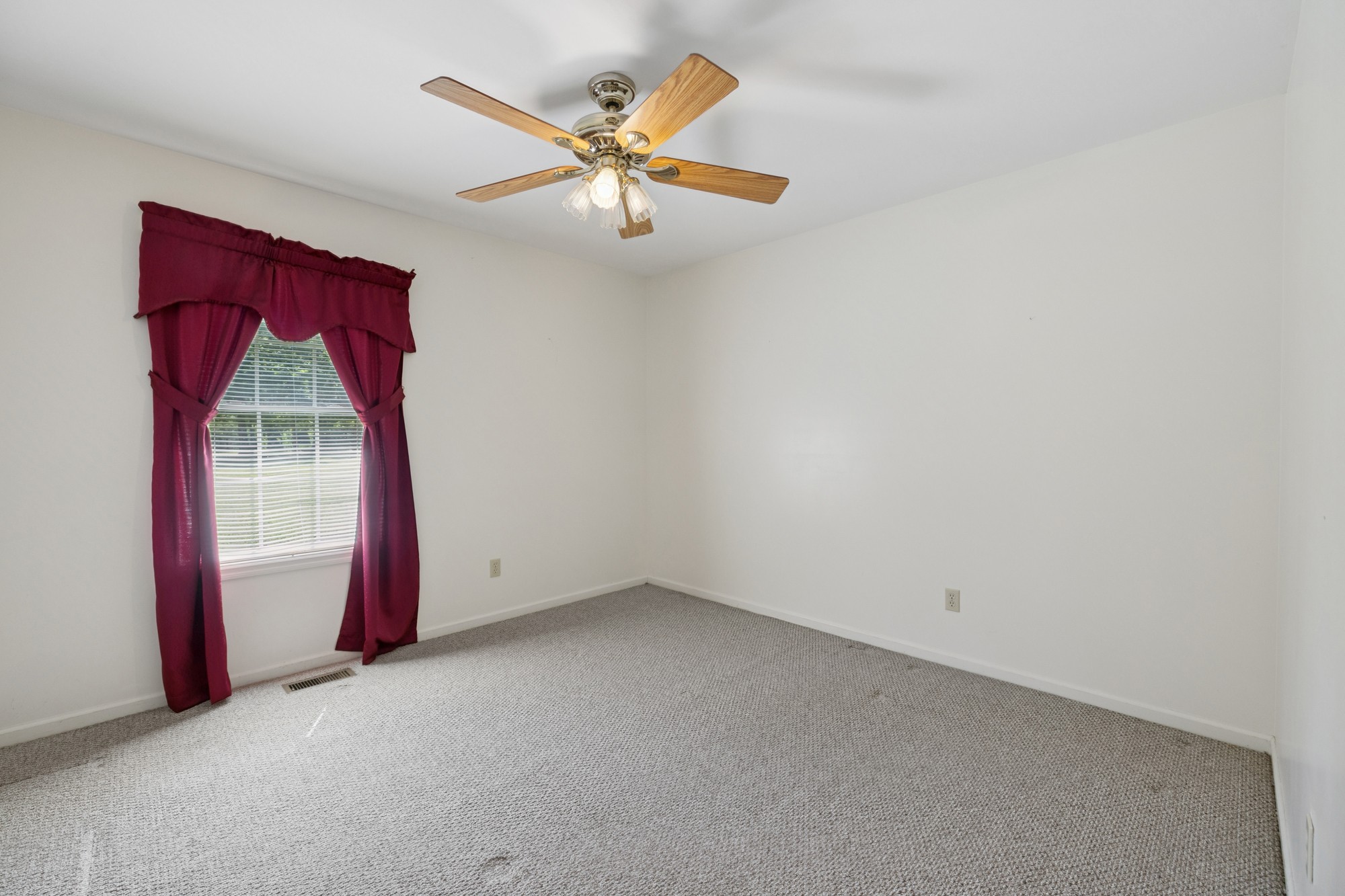 7365 Rowe Gap Road Belvidere, TN 37306 - Photo 34 of 78 an empty room with windows and fan