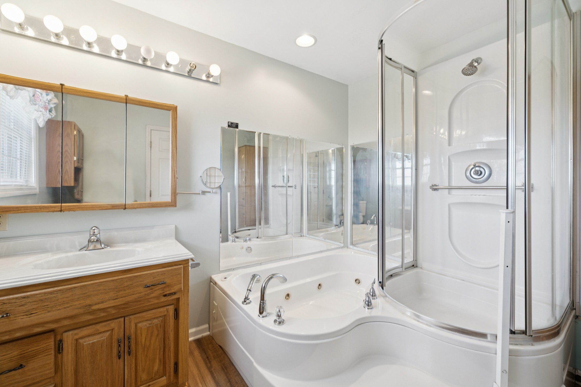 7365 Rowe Gap Road Belvidere, TN 37306 - Photo 40 of 78 a bathroom with a tub sink and mirror