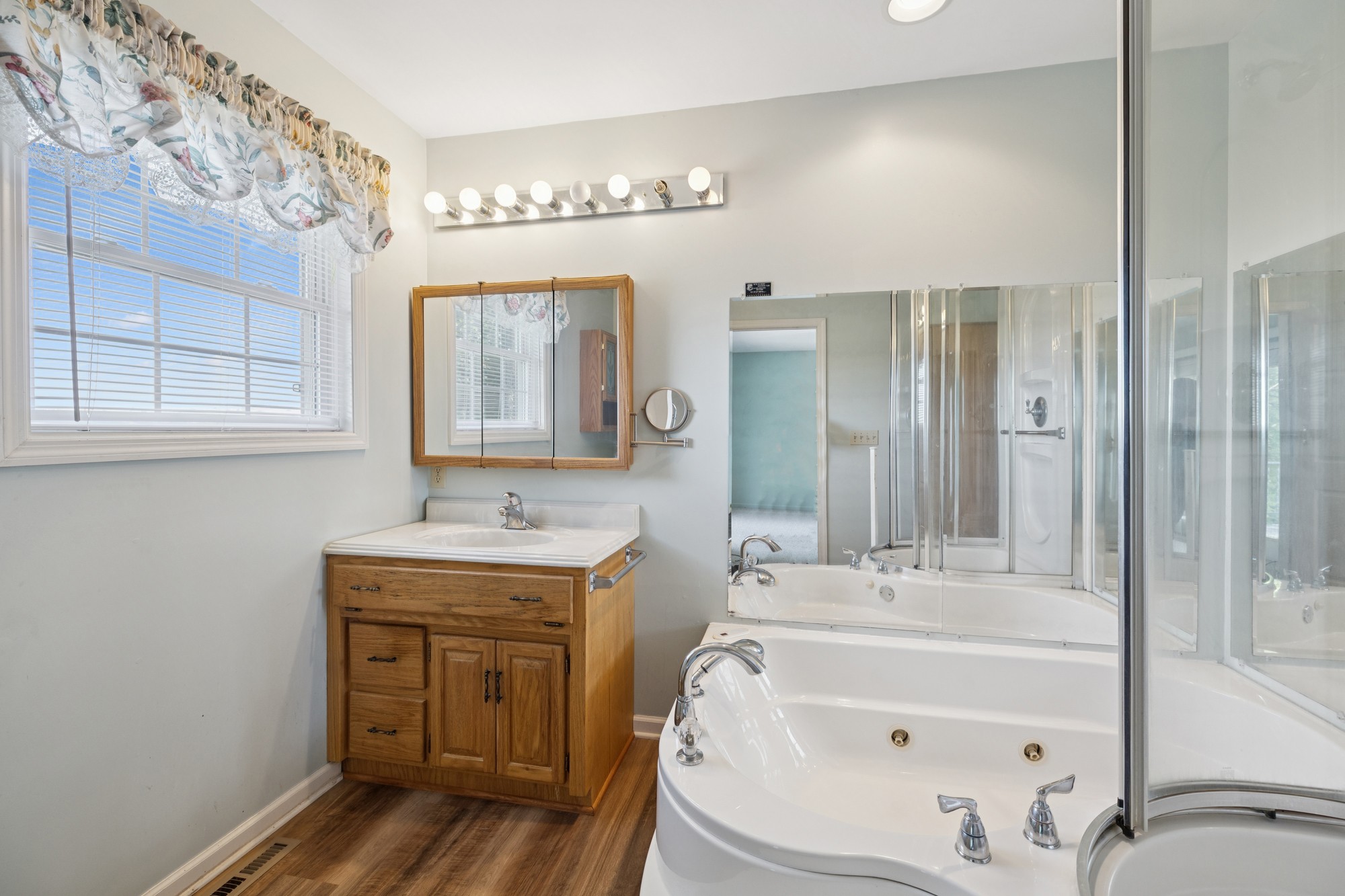 7365 Rowe Gap Road Belvidere, TN 37306 - Photo 42 of 78 a bathroom with a tub sink and mirror