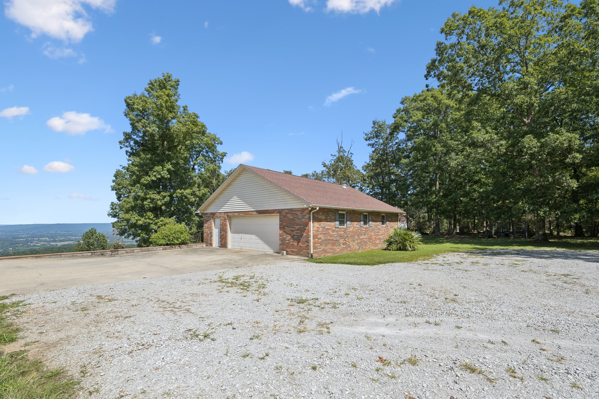 7365 Rowe Gap Road Belvidere, TN 37306 - Photo 49 of 78 a view of a dirt road and a building in the background