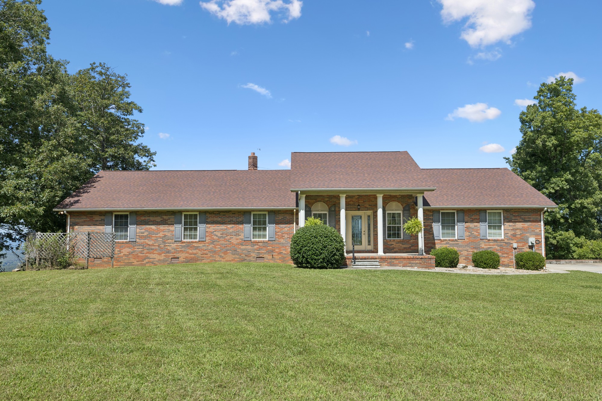 7365 Rowe Gap Road Belvidere, TN 37306 - Photo 5 of 78 a front view of a house with a yard