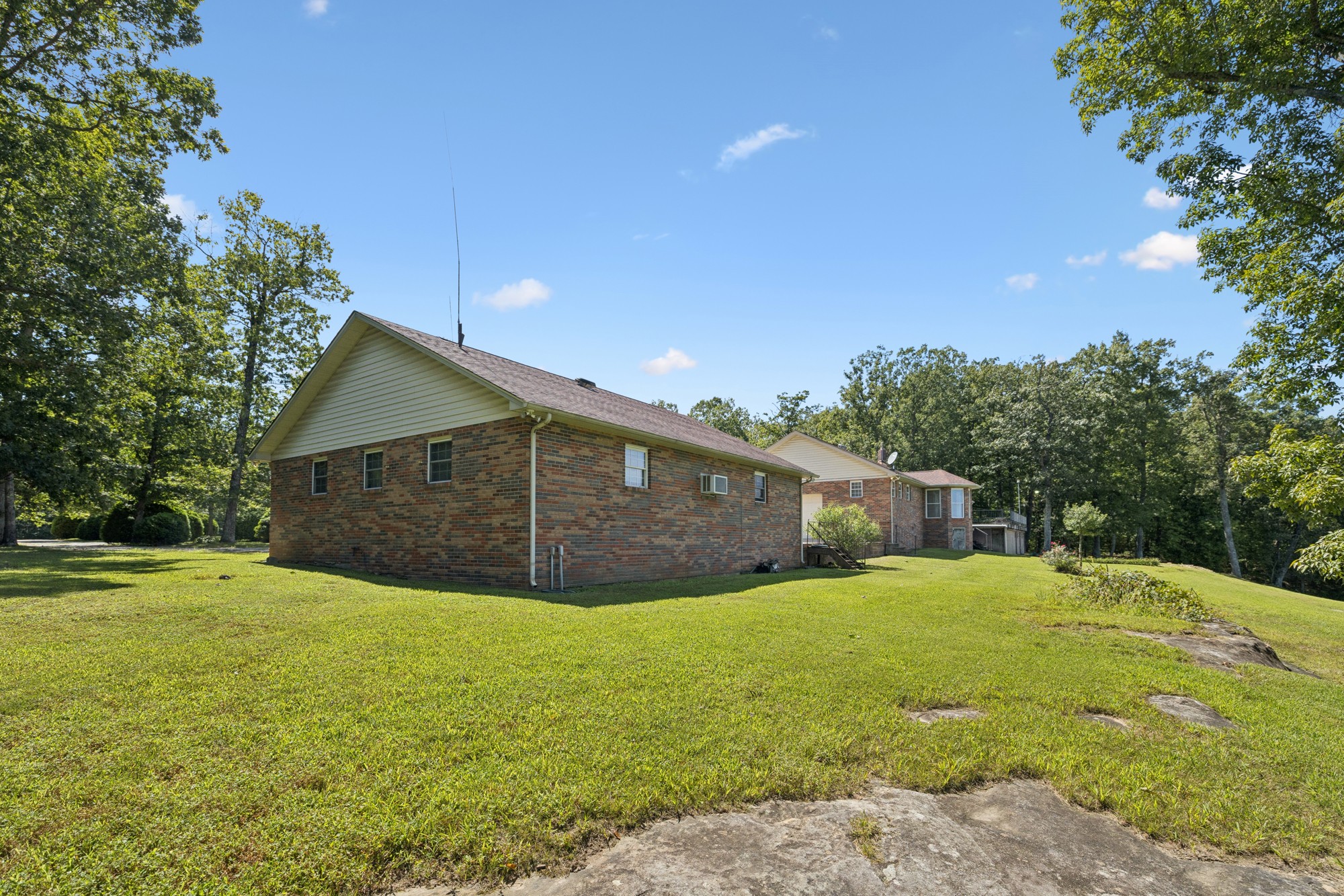7365 Rowe Gap Road Belvidere, TN 37306 - Photo 51 of 78 a view of an house with backyard and trees