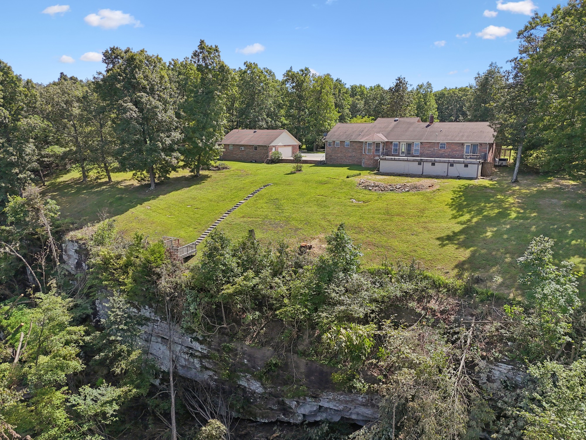 7365 Rowe Gap Road Belvidere, TN 37306 - Photo 74 of 78 a view of a house with pool and a yard