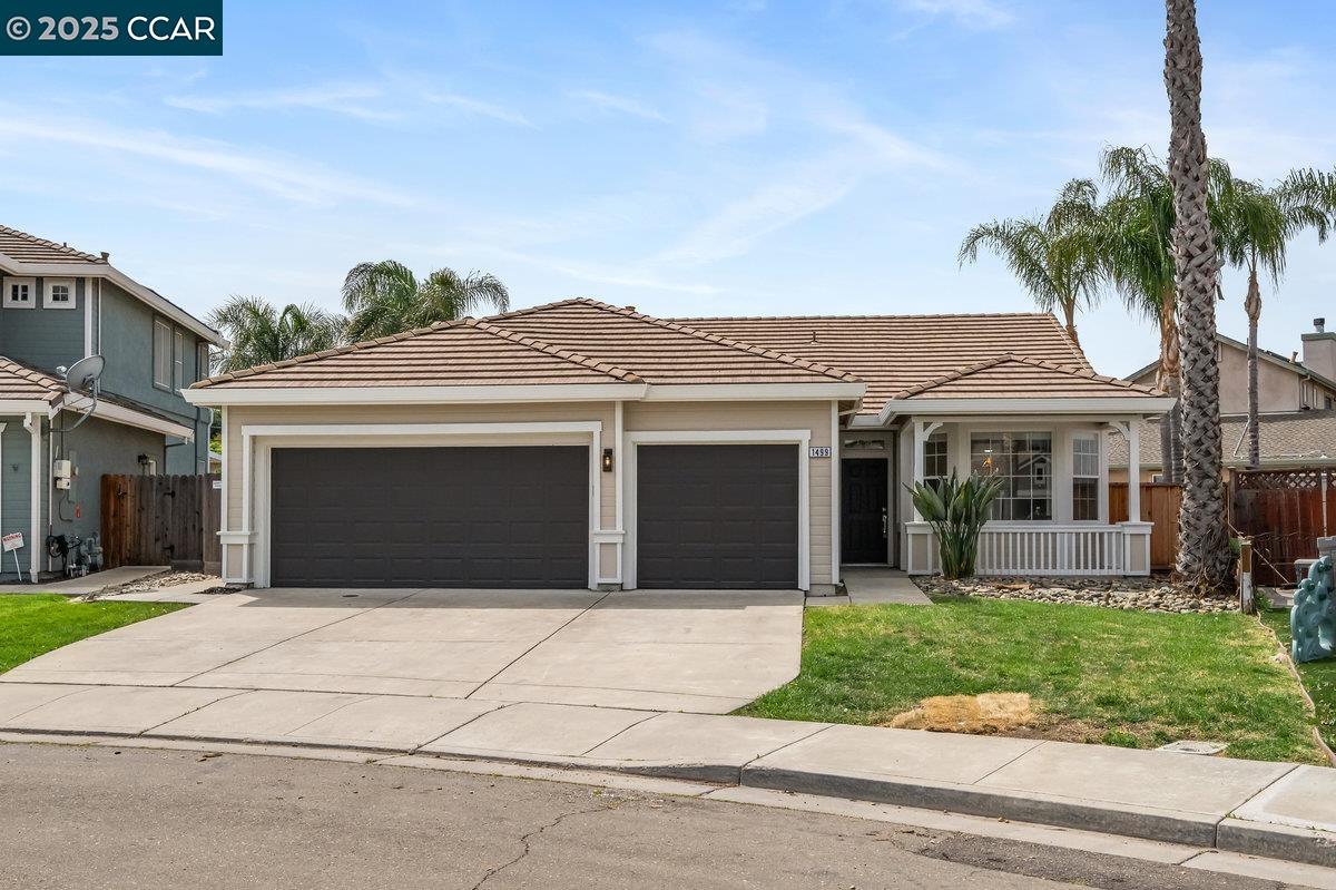 a front view of a house with a garden and entryway