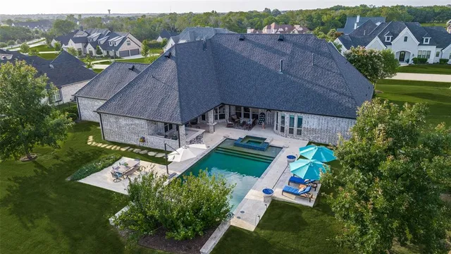 an aerial view of a house with a garden