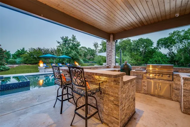a patio with table and chairs