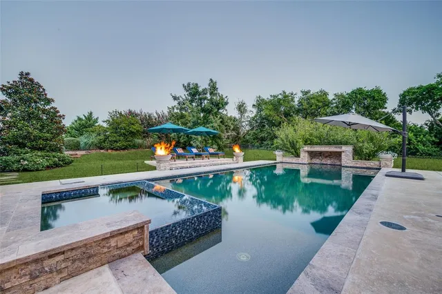 a view of a lake with a wooden bridge
