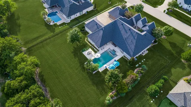 an aerial view of a house with a garden