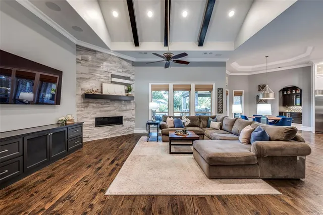 a living room with furniture fireplace and a flat screen tv