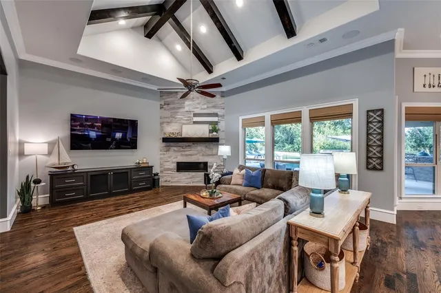 a living room with fireplace furniture and a flat screen tv
