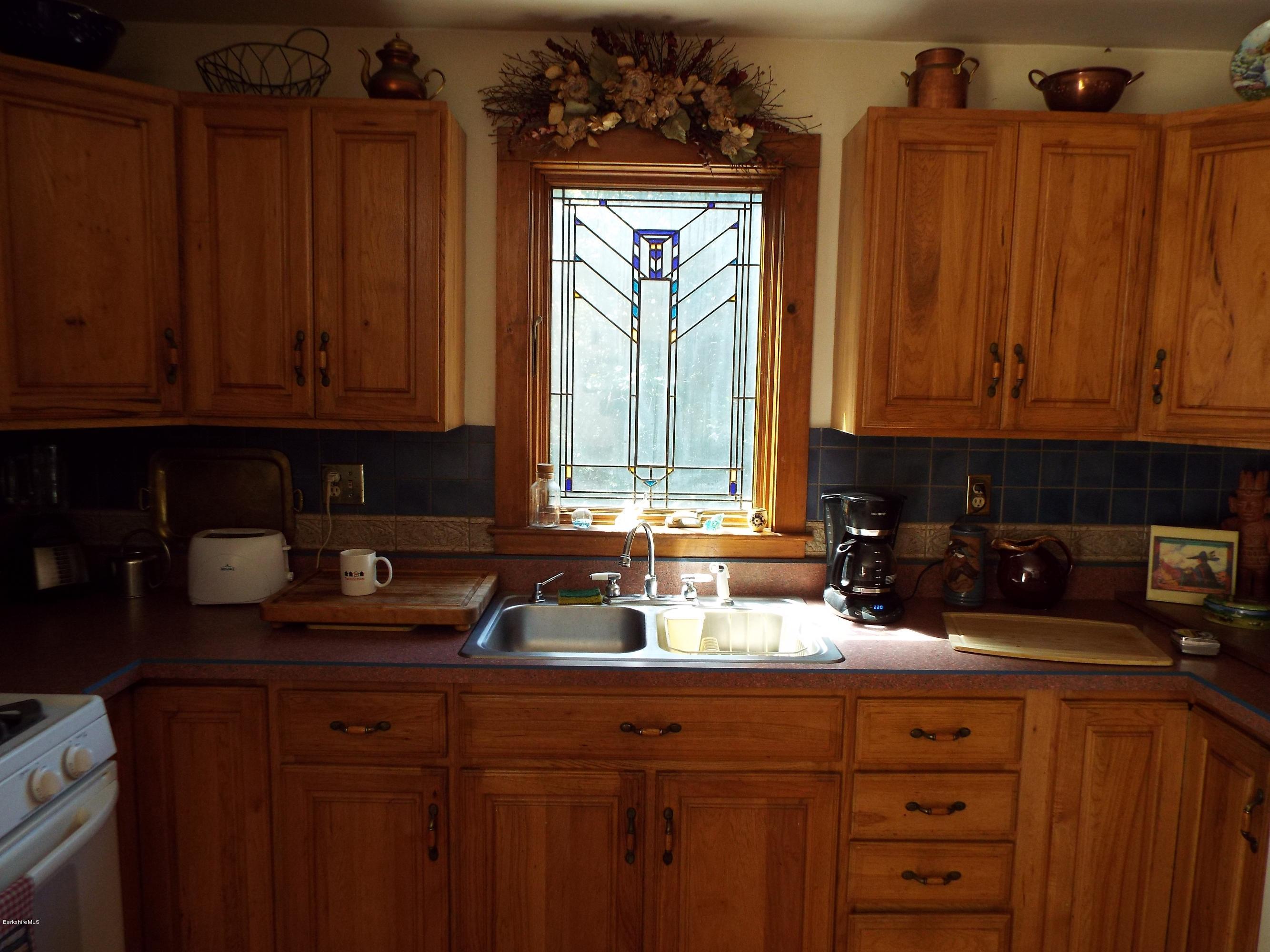 12 August Smith Road Peru, MA 01235 - Photo 6 of 11 a kitchen with sink a window and cabinets