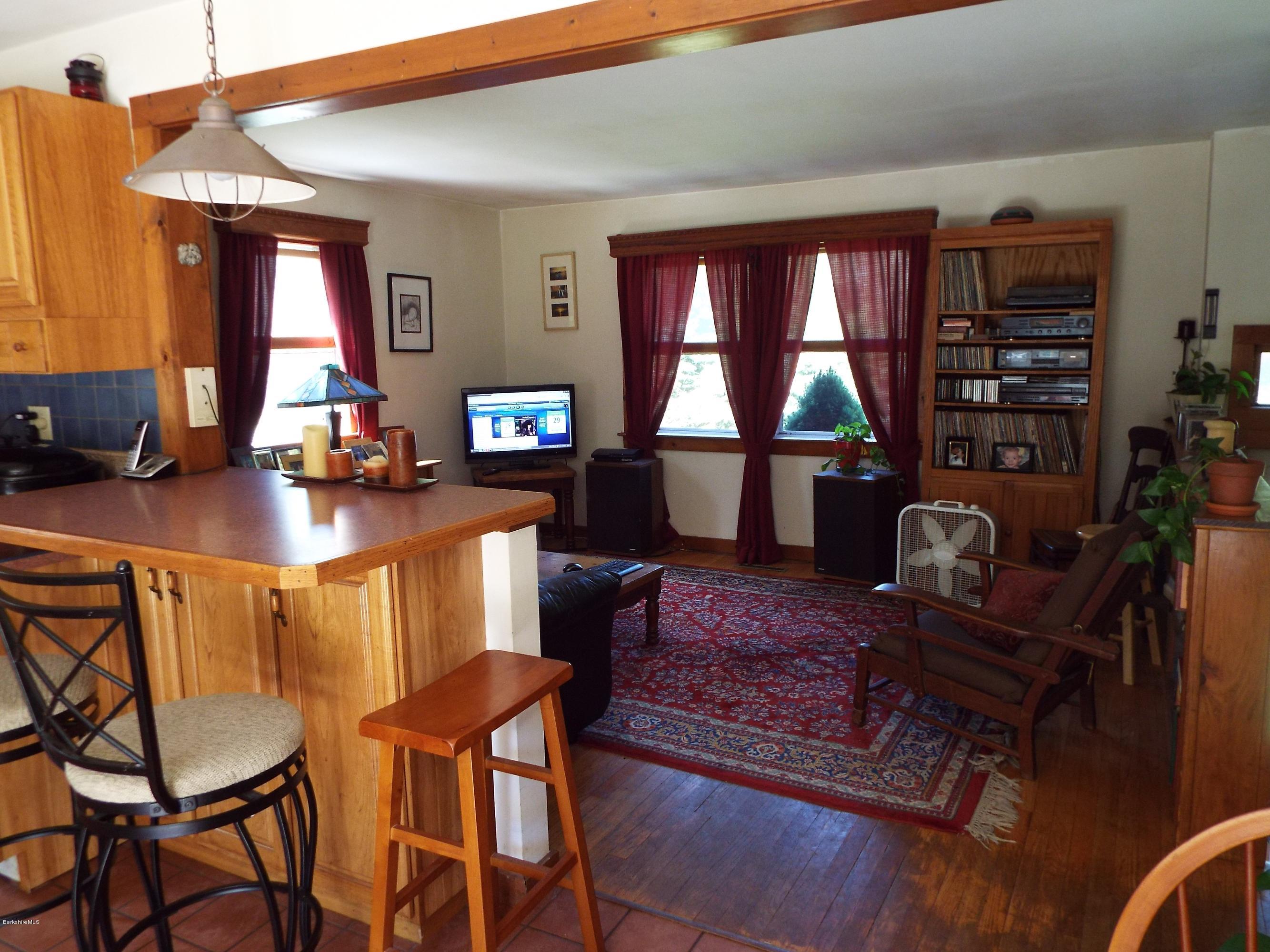 12 August Smith Road Peru, MA 01235 - Photo 7 of 11 a dining room with furniture a rug and wooden floor