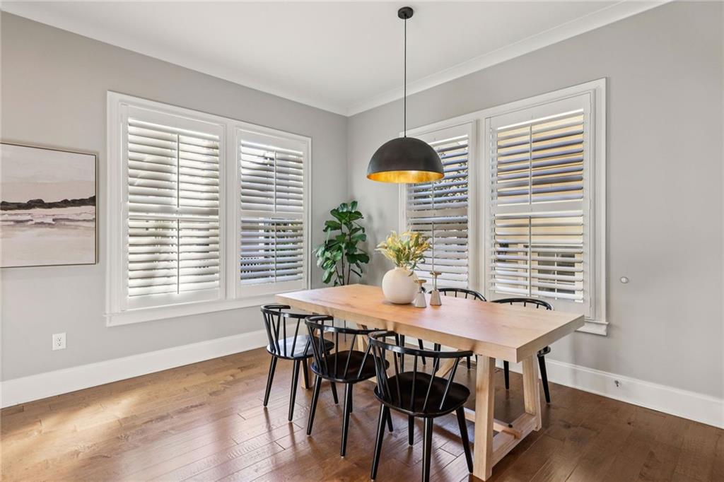 7345 Samples Field Road Cumming, GA 30040 - Photo 12 of 29 a view of a dining room with furniture window and wooden floor