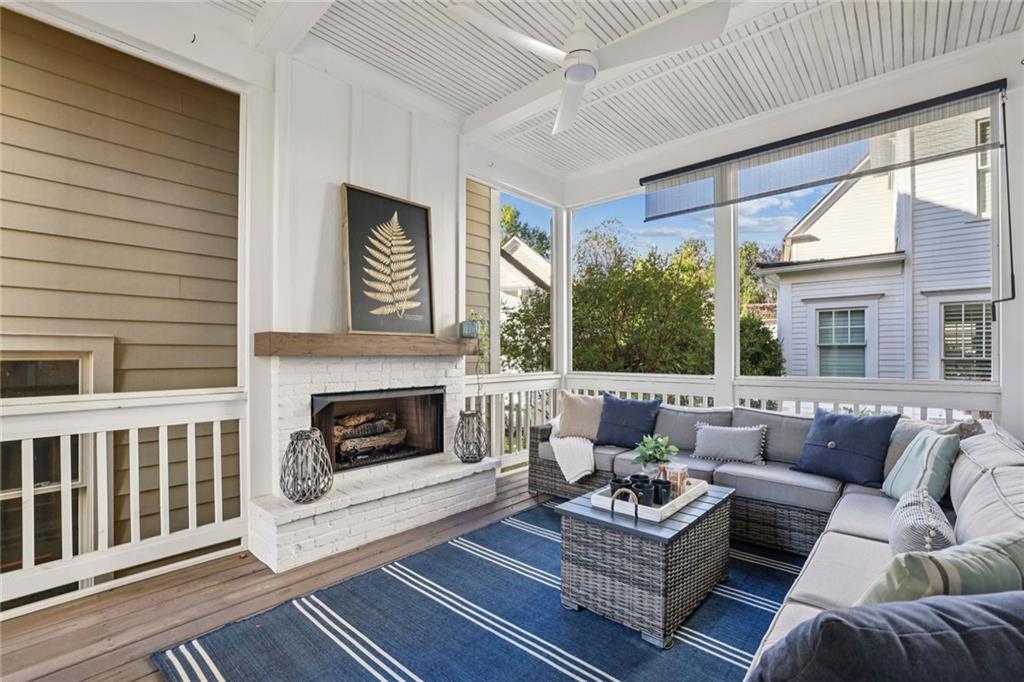 7345 Samples Field Road Cumming, GA 30040 - Photo 16 of 29 a living room with furniture a window and a fireplace