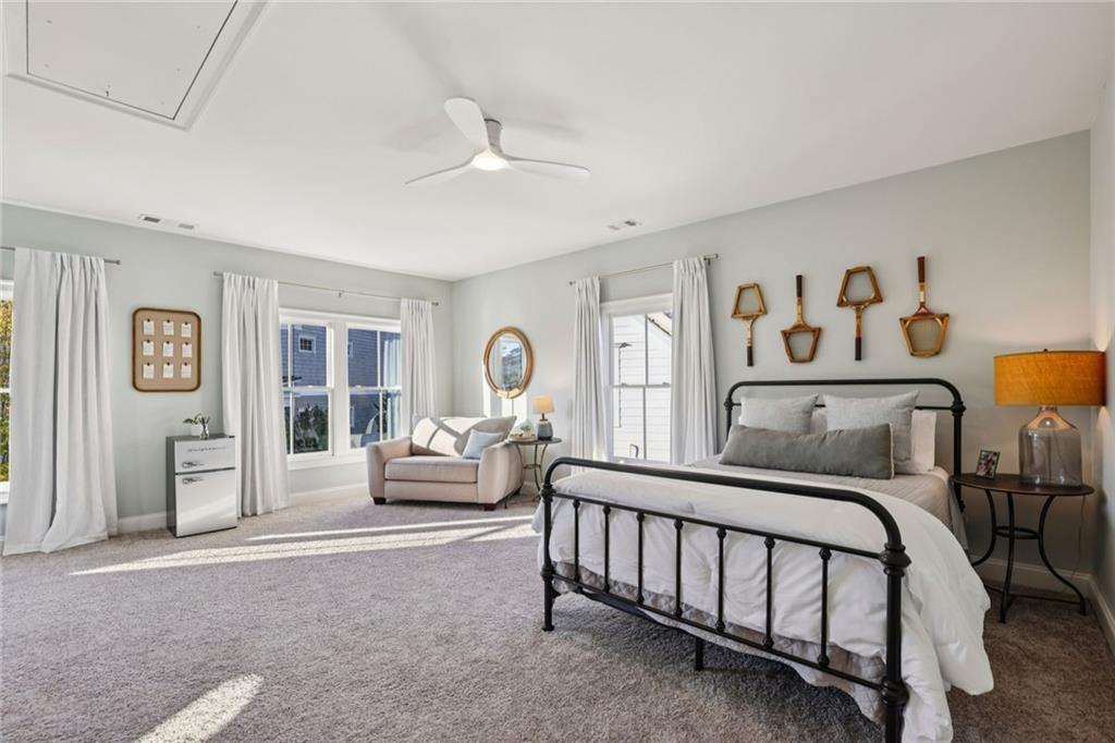 7345 Samples Field Road Cumming, GA 30040 - Photo 17 of 29 a bedroom with a bed and a large window