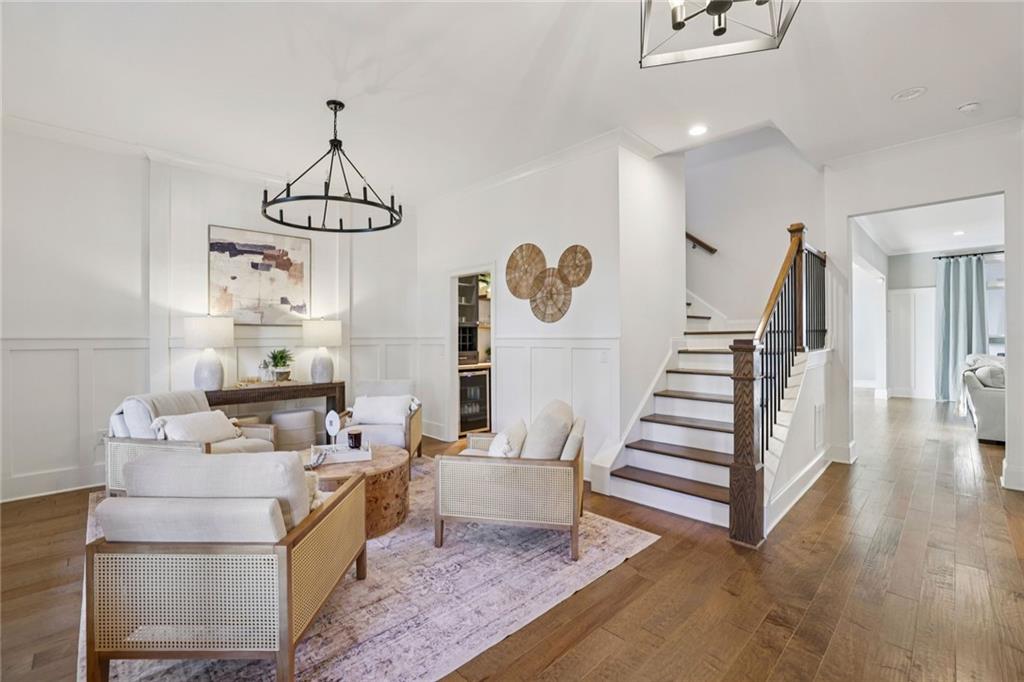 7345 Samples Field Road Cumming, GA 30040 - Photo 19 of 29 a living room with furniture and wooden floor