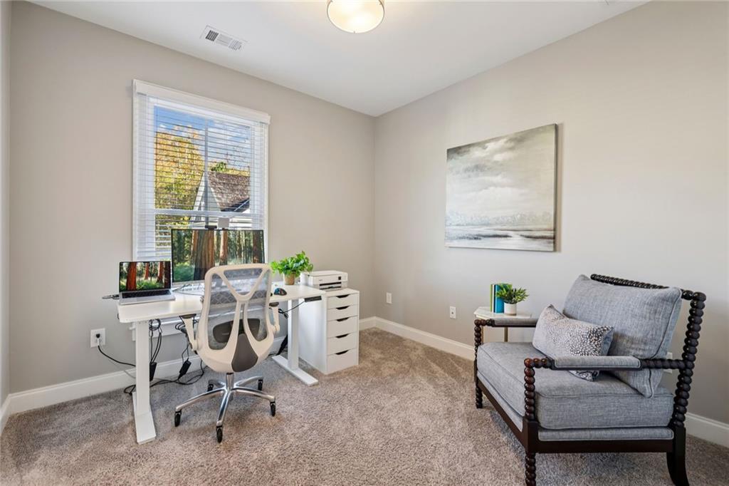 7345 Samples Field Road Cumming, GA 30040 - Photo 23 of 29 a work room with furniture and windows