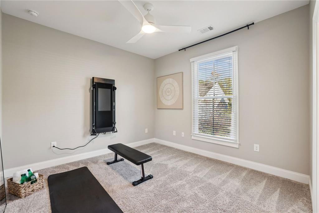 7345 Samples Field Road Cumming, GA 30040 - Photo 24 of 29 a living room with furniture