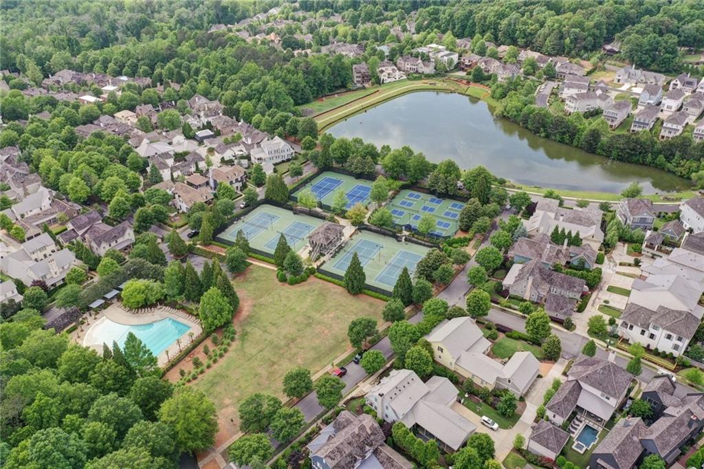7345 Samples Field Road Cumming, GA 30040 - Photo 27 of 29 an aerial view of residential houses with outdoor space and trees all around