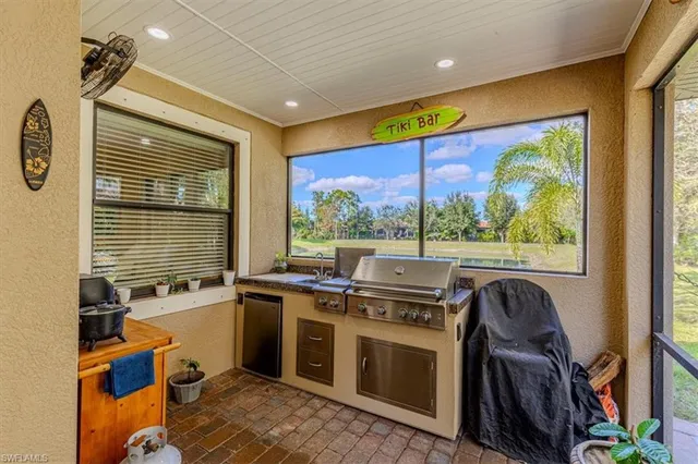 a view of a kitchen with a sink and dishwasher